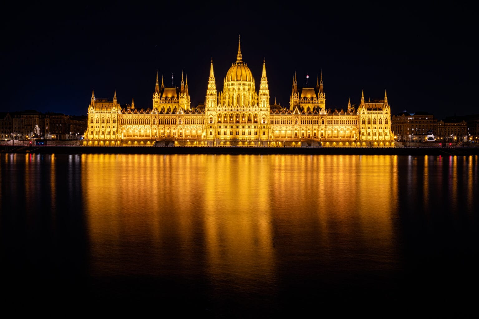 Hungarian Parliament lit gold on the Danube at blue hour, Budapest