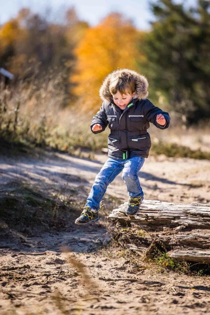 Wyatt jumping off a log