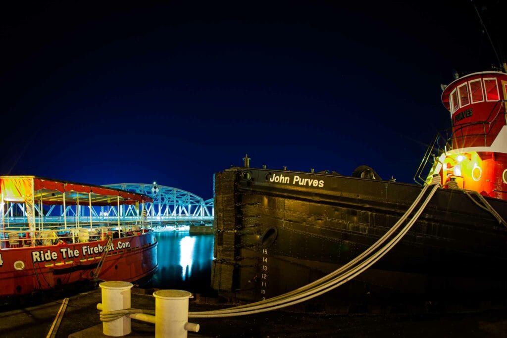 Tugboat lit at night