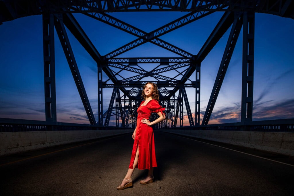 Ainsley in a red dress on the Cass Street Bridge at blue hour, La Crosse