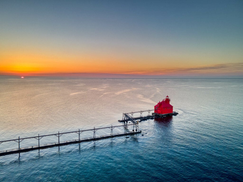 The Sturgeon Bay pierhead light and its catwalk from above at sunrise