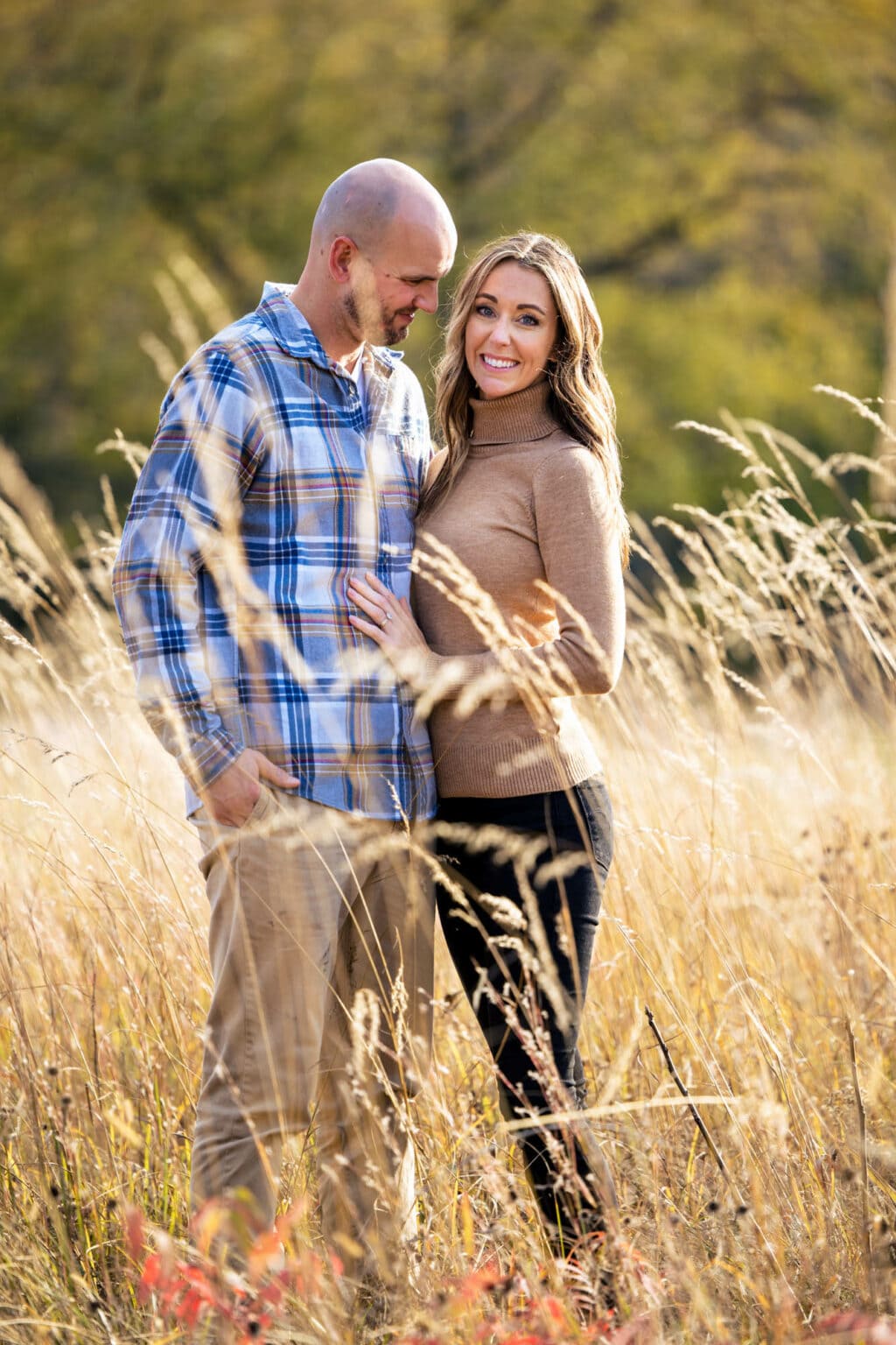 An engaged couple in tall grass at Perrot State Park, Trempealeau