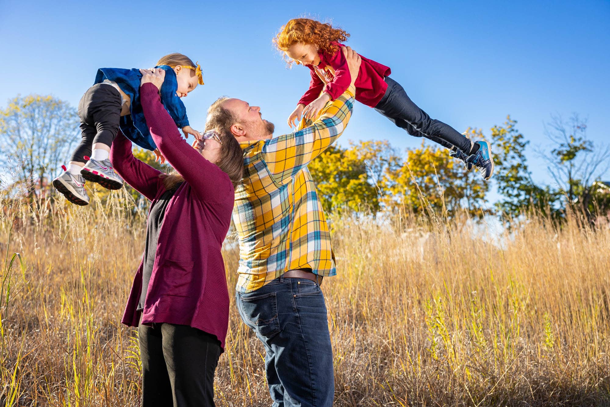 Myrick Park kids in air by Photographer Jeff Wiswell of J.L. Wiswell Photography