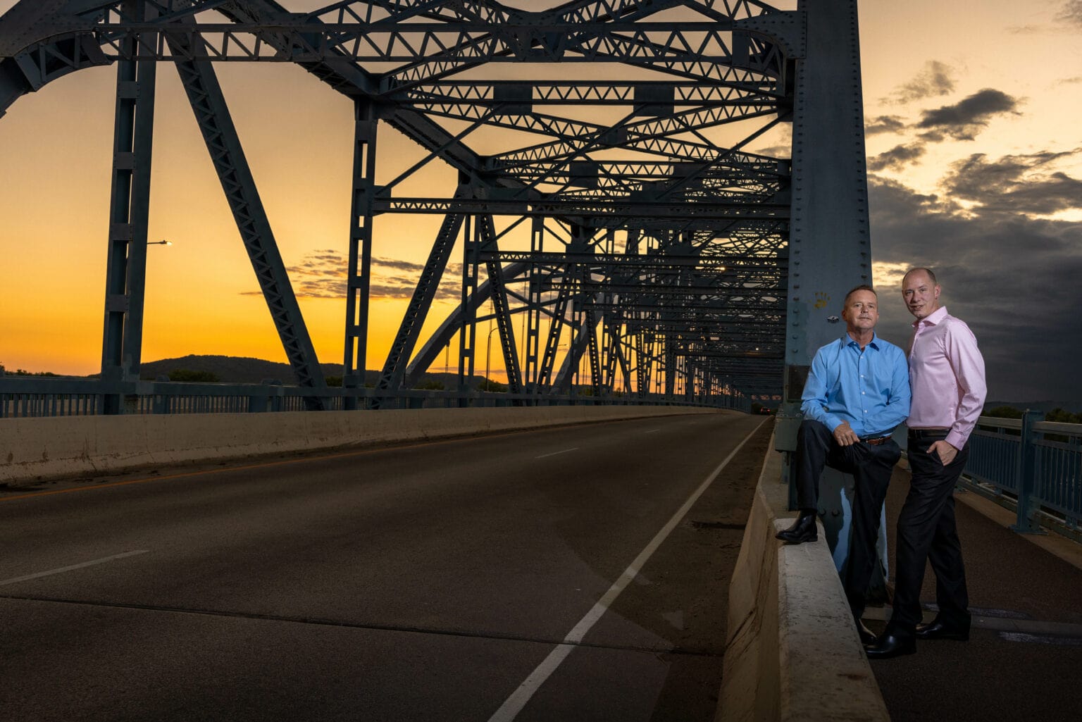 An engaged couple on the Cass Street Bridge at sunset, La Crosse