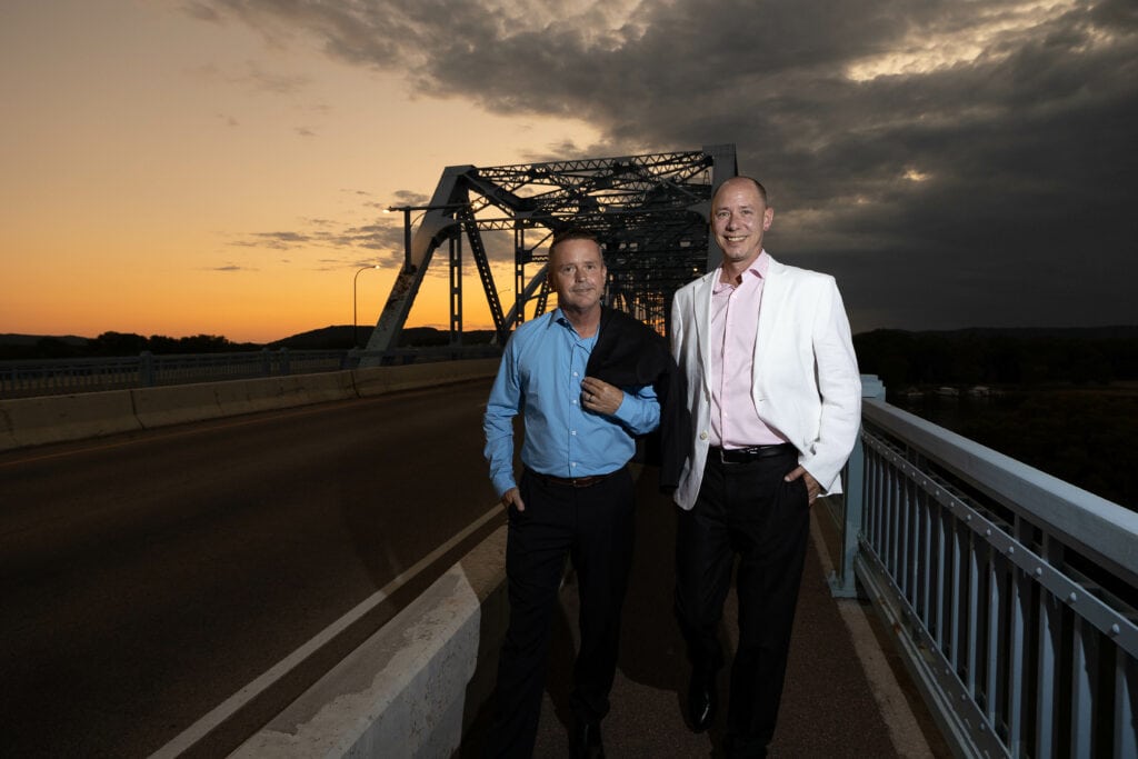 An engaged couple on the Cass Street Bridge at sunset, La Crosse