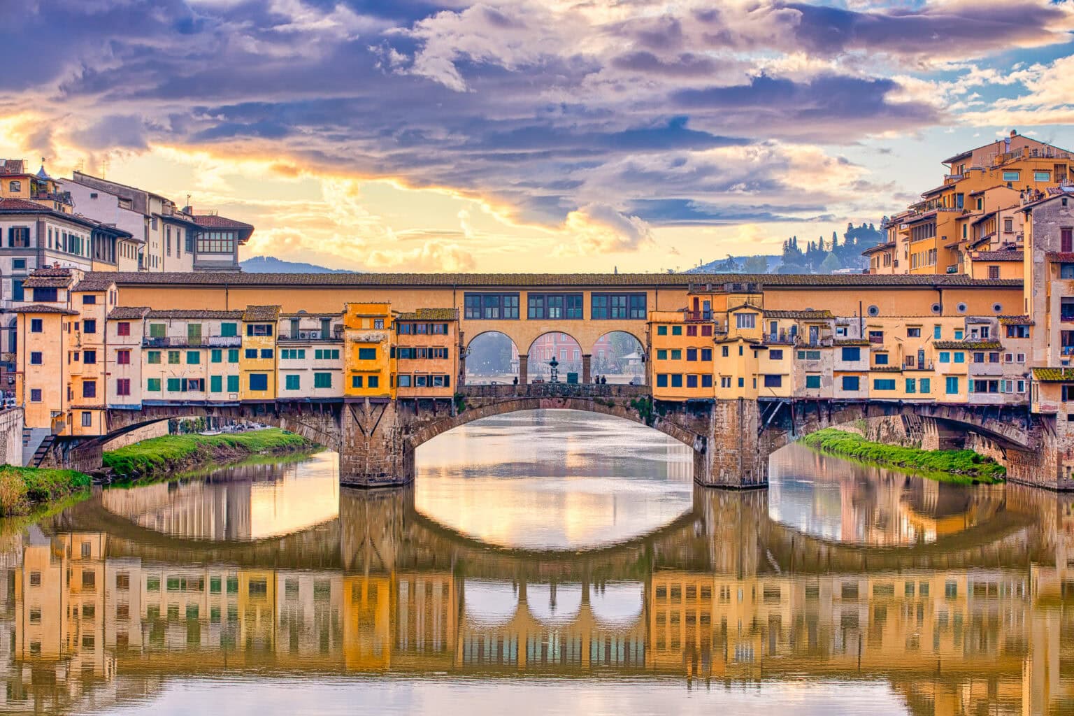 The Ponte Vecchio over a calm Arno in Florence