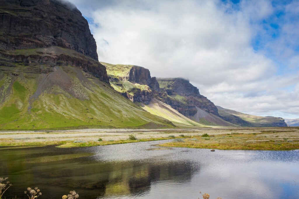 Green cliffs and river