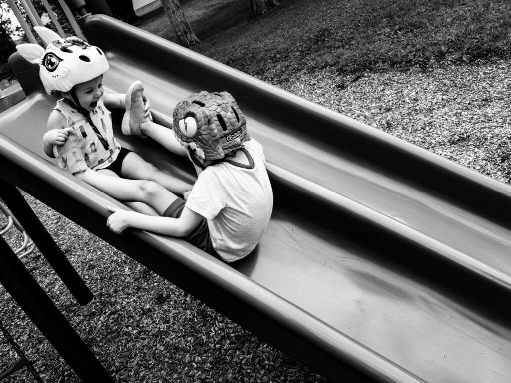 Kids on a slide, family session in Onalaska