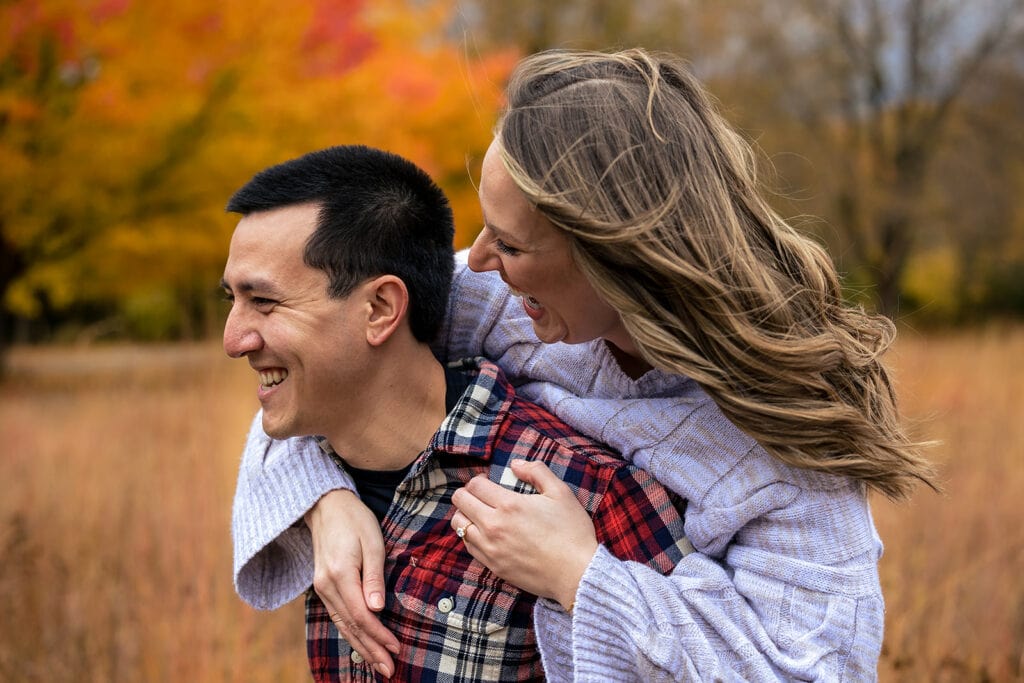 Engaged couple outdoors during an autumn session near La Crosse