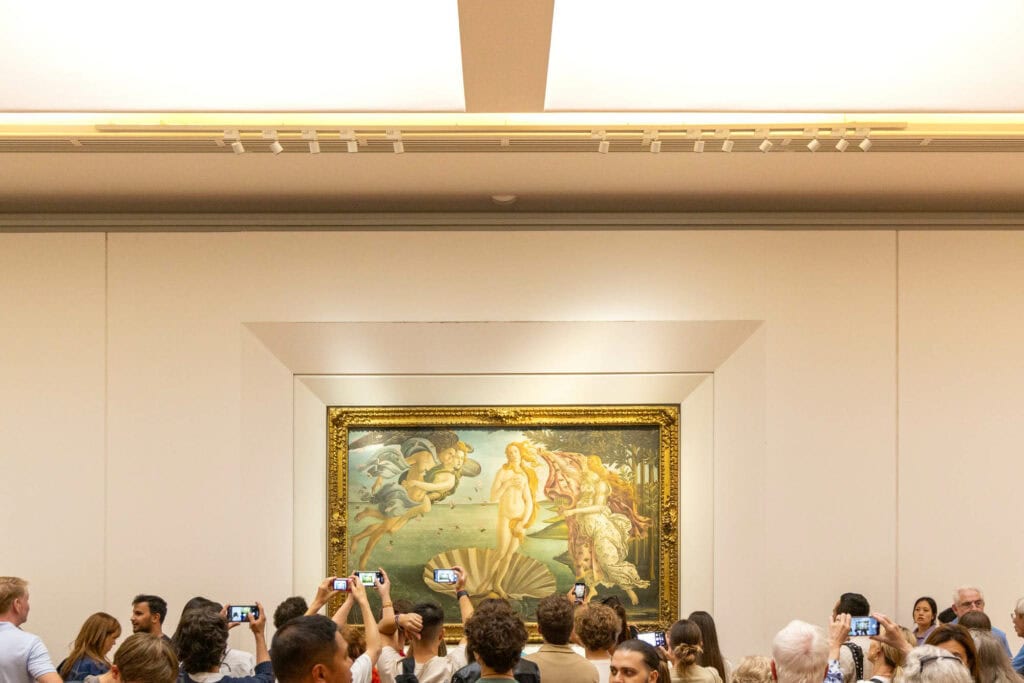 Visitors photograph Botticelli's Birth of Venus in the Uffizi Gallery, Florence, Italy