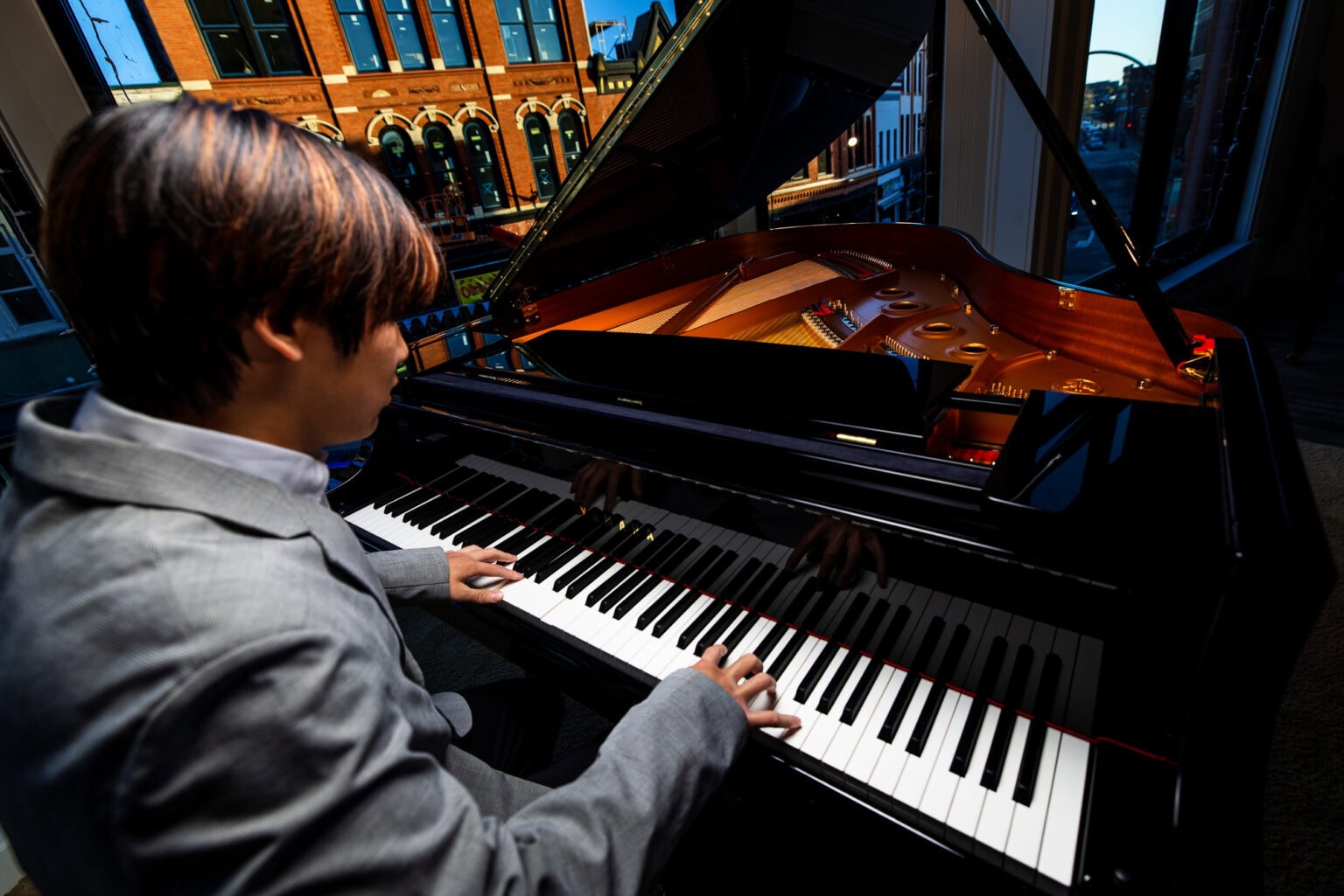 Young musician at a grand piano