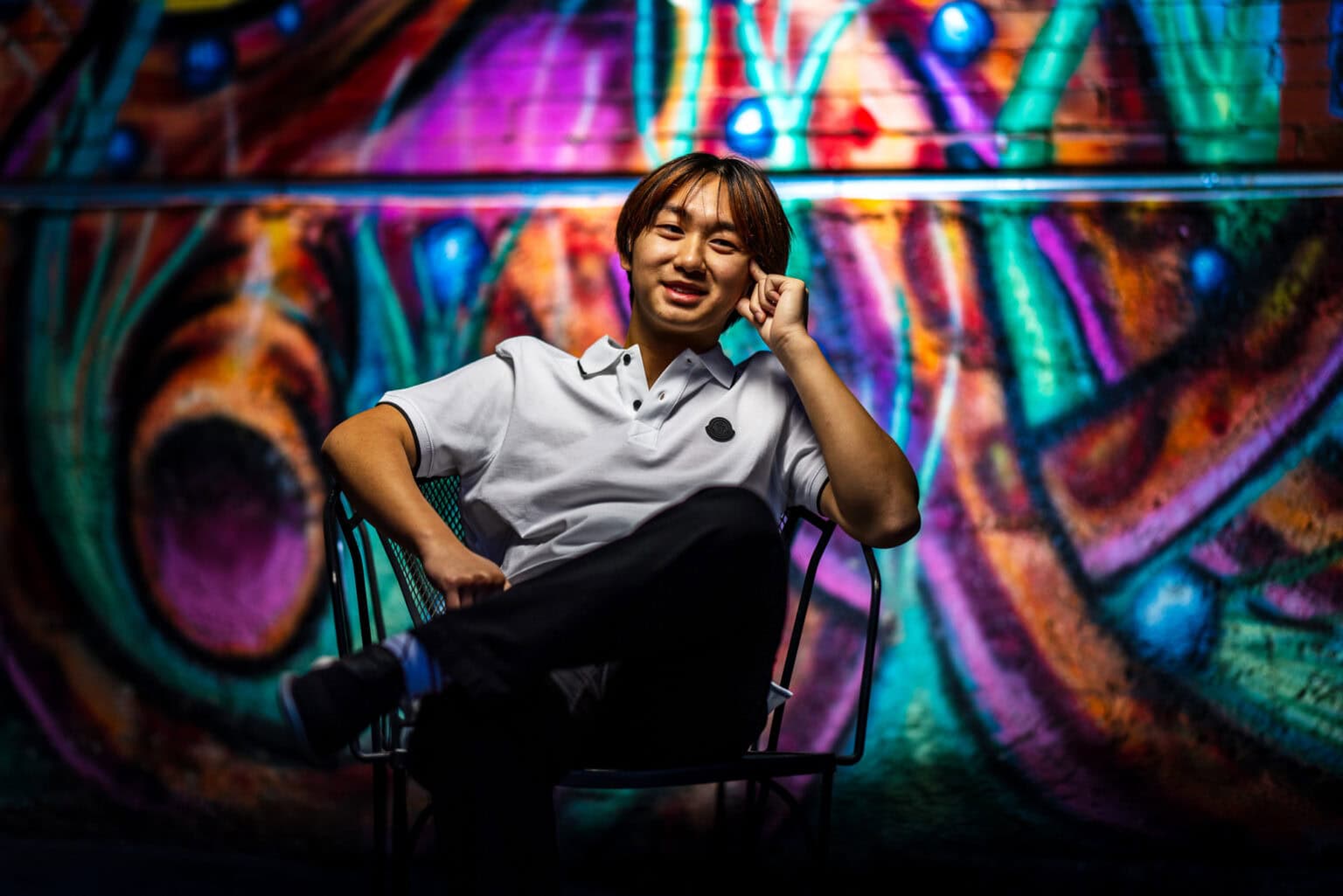 Onalaska senior sitting in a chair, phone in hand