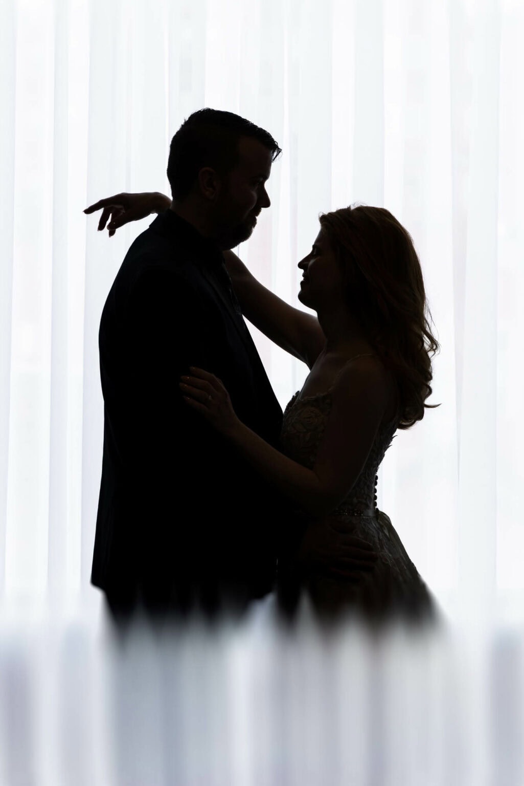 A bride and groom in silhouette at The Court Above Main