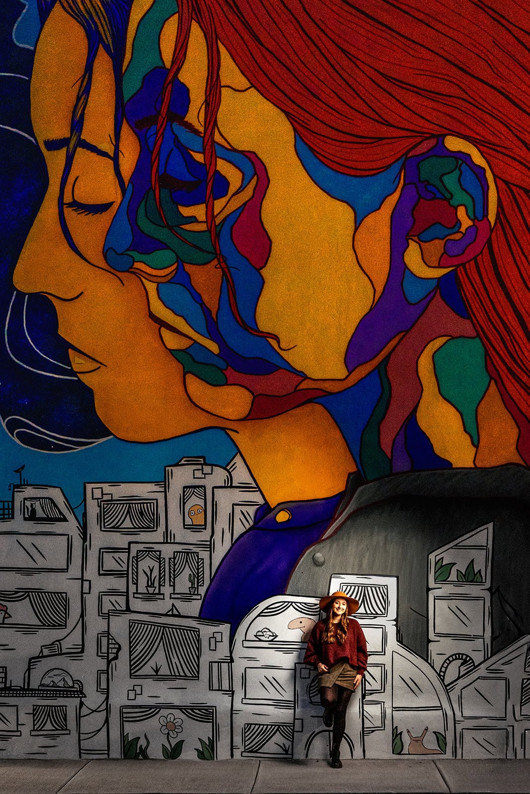 Senior photo near a mural in downtown La Crosse, WI taken by Jeff and Alisha Wiswell