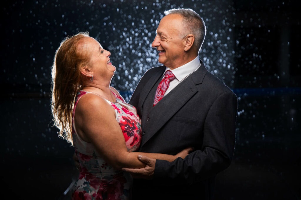 Tina and Howard laughing in the rain, downtown La Crosse