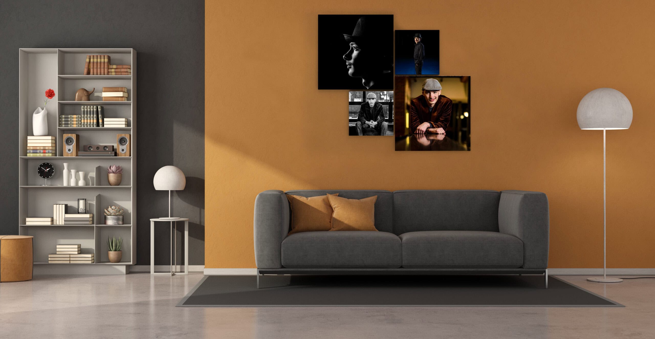 A collection of four senior portraits hung as a cluster above a grey sofa in a warm living room