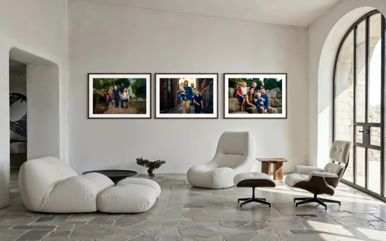 Three framed family portraits in a living room