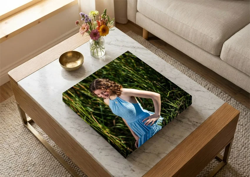 EDGE album with a senior portrait cover on a coffee table