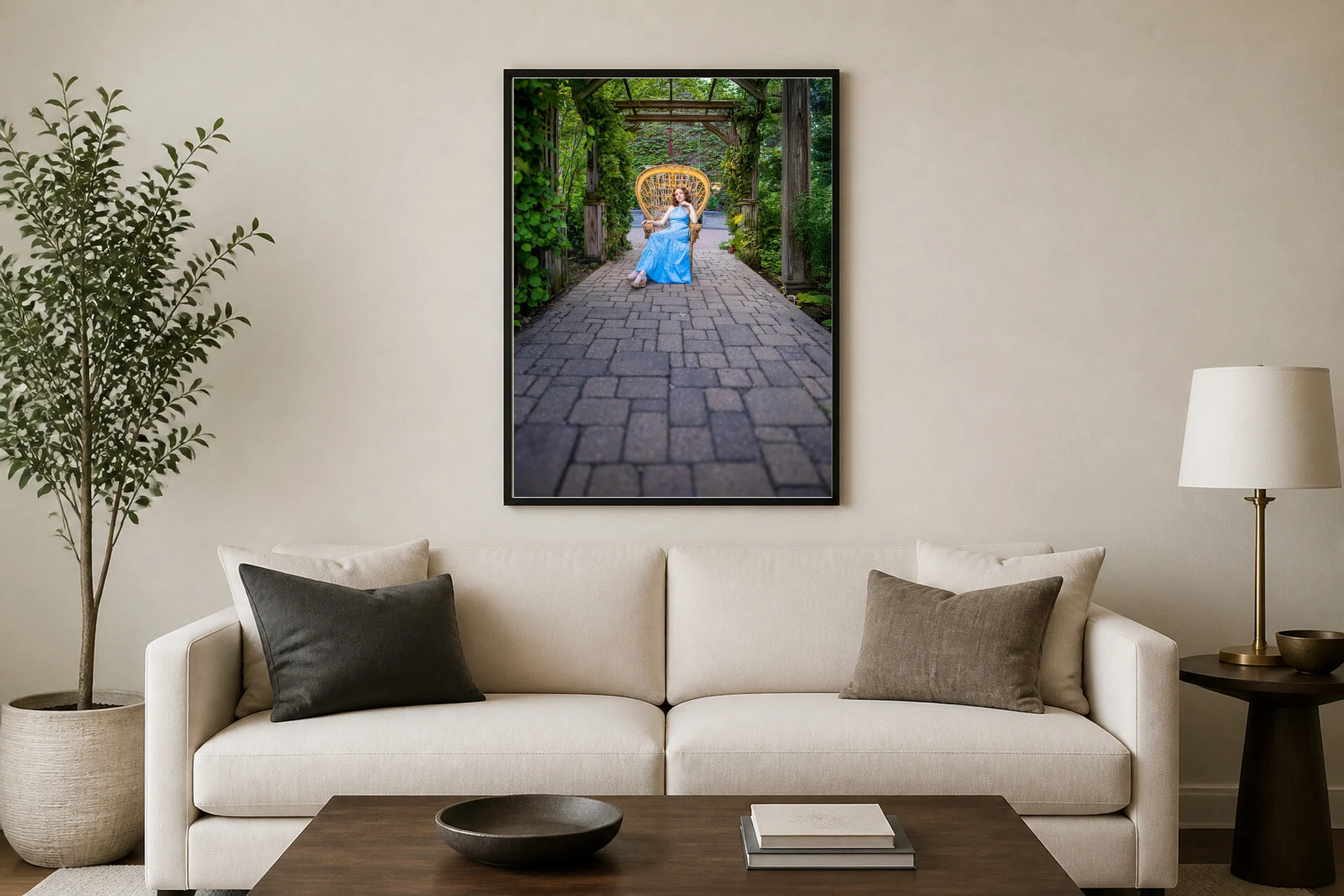 A senior portrait above a sofa in a living room