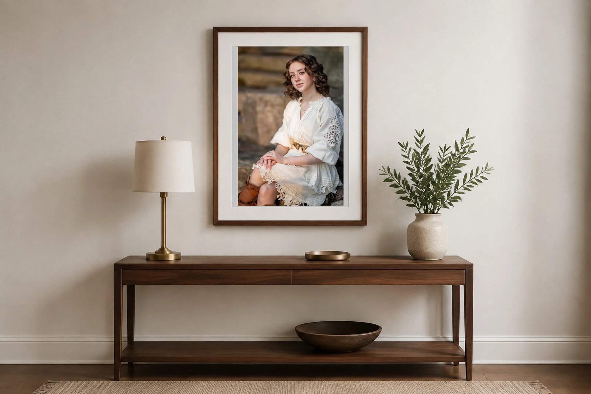 A senior portrait above an entry console