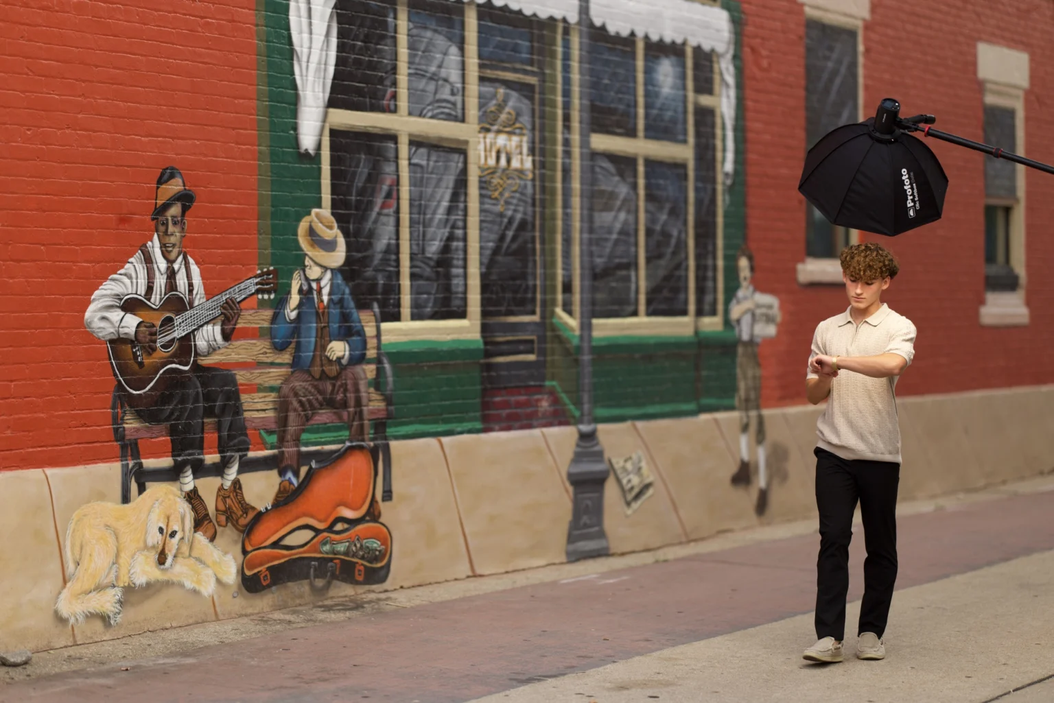 Straight out of the camera — A mural wall, a boom arm in the frame.